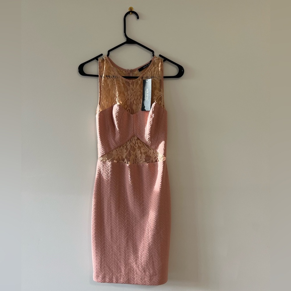 New with tags and never worn. Very flattering :) Size small